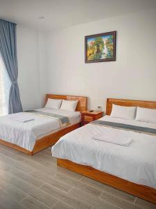 Cama o camas de una habitación en Hotel Thiện Nhiên