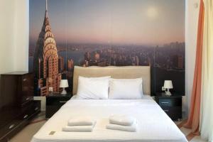 Ένα ή περισσότερα κρεβάτια σε δωμάτιο στο Cozy Studio Near the Beach