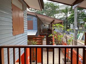 a balcony of a house with orange and blue at Bed in Beyt Boutique Hotel in Nonthaburi