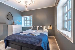 Postel nebo postele na pokoji v ubytování Lofoten Apartments