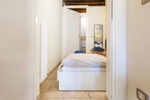 Ein Bett oder Betten in einem Zimmer der Unterkunft A due passi della casa natale del Maestro Toscanini