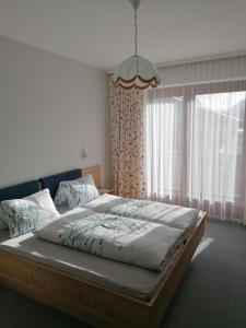 Кровать или кровати в номере Ferienhaus Mattersberger