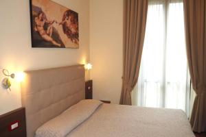 Postel nebo postele na pokoji v ubytování Hotel Ester