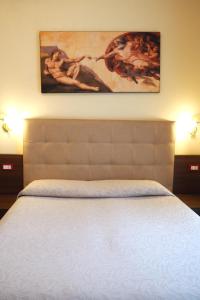 Postel nebo postele na pokoji v ubytování Hotel Ester