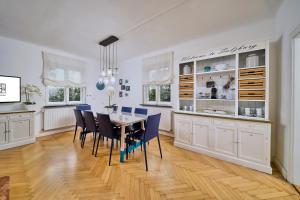 a dining room with a table and chairs at Salzburg Residence by Welcome to Salzburg in Salzburg