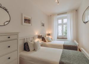 Posteľ alebo postele v izbe v ubytovaní Apartament Rynek - Zielona Kamienica