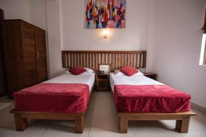 A bed or beds in a room at Port View City Hotel