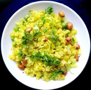a white plate of rice with broccoli and nuts at Bigfoot Stay - Forganic Farm & Agro Tourism in Khopoli