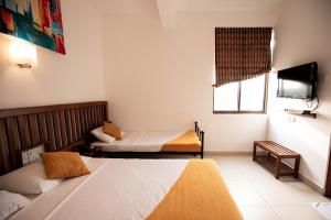 A bed or beds in a room at Port View City Hotel