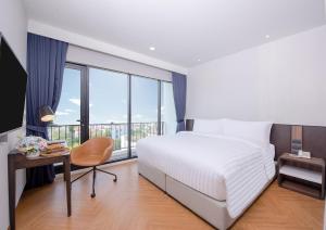 Una cama o camas en una habitación de Amanta Hotel & Residence Sathorn