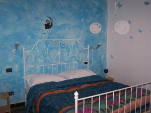 Säng eller sängar i ett rum på Affittacamere Buenos Ayres