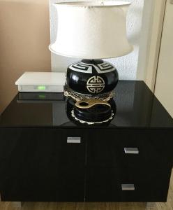 a lamp on top of a black table at ZenGarden Pool,3bedrooms,lit bébé Beach800m,box&wifi in Antibes