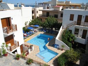 an aerial view of a building with a swimming pool at Blue Sea Hotel Apartments in Rethymno