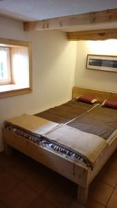 A bed or beds in a room at Knödl-Alm Waldhäusl
