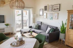 a living room with a couch and a table at Bergkiefer - Ferienwohnung in Oy-Mittelberg