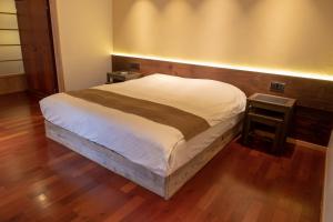 Letto o letti in una camera di ISANA Resort