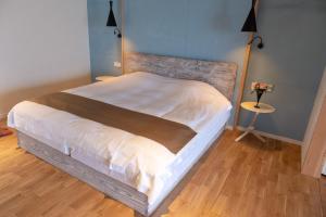 Letto o letti in una camera di ISANA Resort