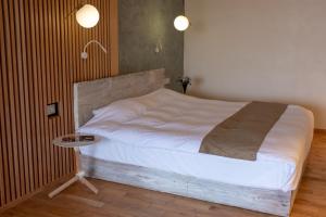 Letto o letti in una camera di ISANA Resort