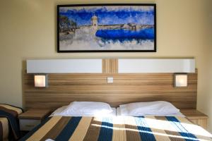 Postel nebo postele na pokoji v ubytování Coral Hotel