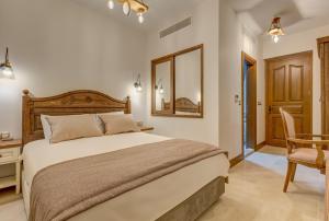 Кровать или кровати в номере Navalia Hotel