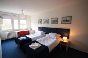 מיטה או מיטות בחדר ב-Studencki Dom Marynarza Pasat