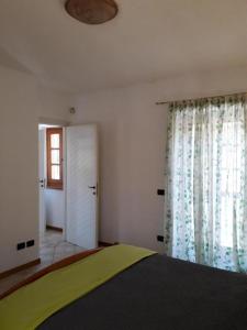 Postel nebo postele na pokoji v ubytování Agriturismo Pastorelli