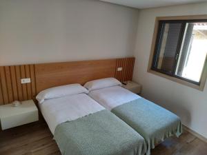 Кровать или кровати в номере Casa Rústica O Facho
