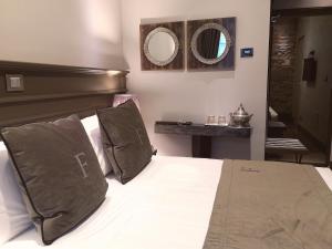 Posteľ alebo postele v izbe v ubytovaní Forvm boutique Hotel + 37 fotografií