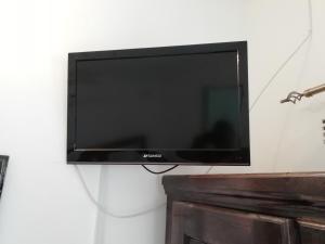 a flat screen tv hanging on a wall at Mashusha Bed & Breakfast in Gaborone