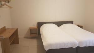 Postel nebo postele na pokoji v ubytování Hoeve Kroonen