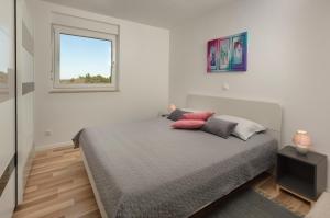 Postel nebo postele na pokoji v ubytování Apartment AleMar