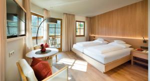 Postel nebo postele na pokoji v ubytování Hotel Spitaler