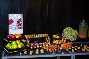 a table topped with lots of fruits and vegetables at Danubius Hotel Hungaria City Center in Budapest