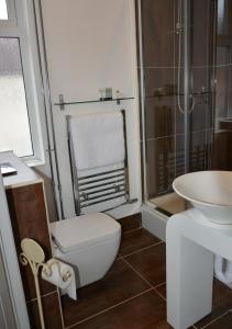 a bathroom with a toilet and a sink at The Bell in Shifnal