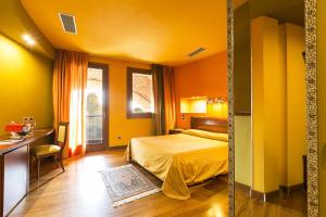 Postel nebo postele na pokoji v ubytování Hotel Due Platani