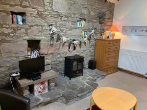 A television and/or entertainment center at Smiddy Barn Apartment 