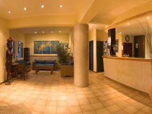 a lobby of a hospital with a waiting room at Hotel Figueretes in Ibiza Town