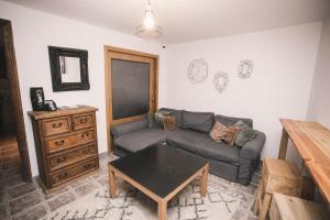 a living room with a couch and a table at Secret Spot Hostel in La Massana