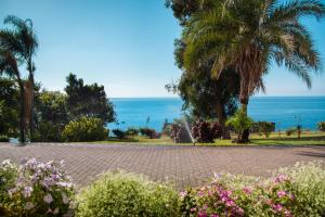 a road with a view of the ocean at Pestana Promenade Ocean Resort Hotel in Funchal