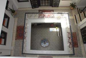 a mirror on the wall of a room at Riad Tingis in Tangier