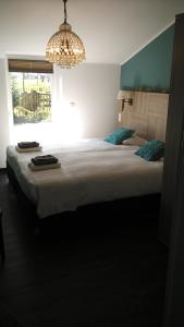 Tempat tidur dalam kamar di Bed & Breakfast El Manso