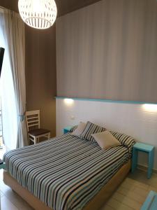 Llit o llits en una habitació de Hotel La Spiaggia