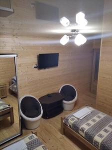 TV a/nebo společenská místnost v ubytování Lisnyi