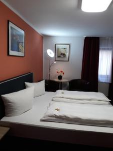 Postel nebo postele na pokoji v ubytování Hotel Luca