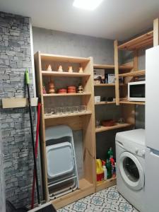 Kuchyň nebo kuchyňský kout v ubytování Apartamento Turístico Santiago