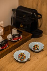 a counter with two paper plates with sprinkles on them at Pousada Corveta in Fernando de Noronha