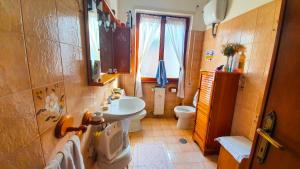 a small bathroom with a sink and a toilet at Bed and breakfast Giuseppina in Rome