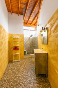 a bathroom with a sink and a toilet at Timanfaya Casa Rural in Yaiza +65 photos
