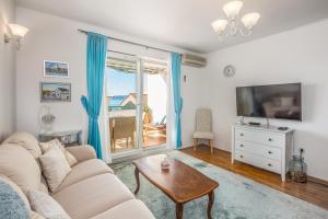 TV a/nebo společenská místnost v ubytování Apartments Royal Residence