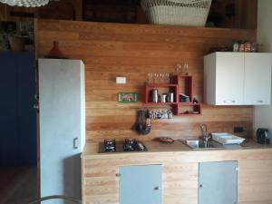 a kitchen with a sink and a refrigerator at Casa Nicole 2 in Borso del Grappa